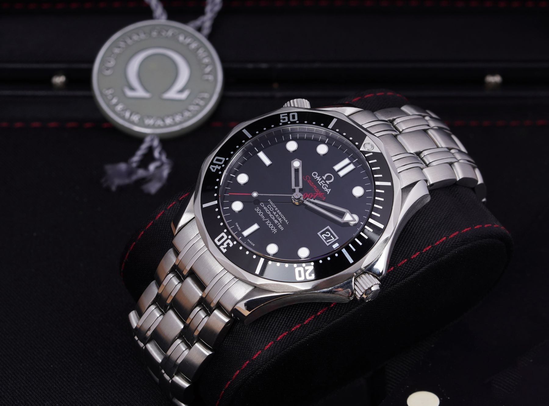Close-up of an Omega Seamaster diver with black dial and steel bracelet