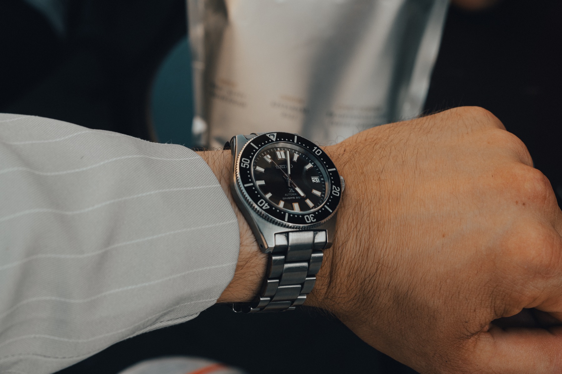 Seiko Prospex SPB143J1 dive watch worn on the wrist with a steel bracelet